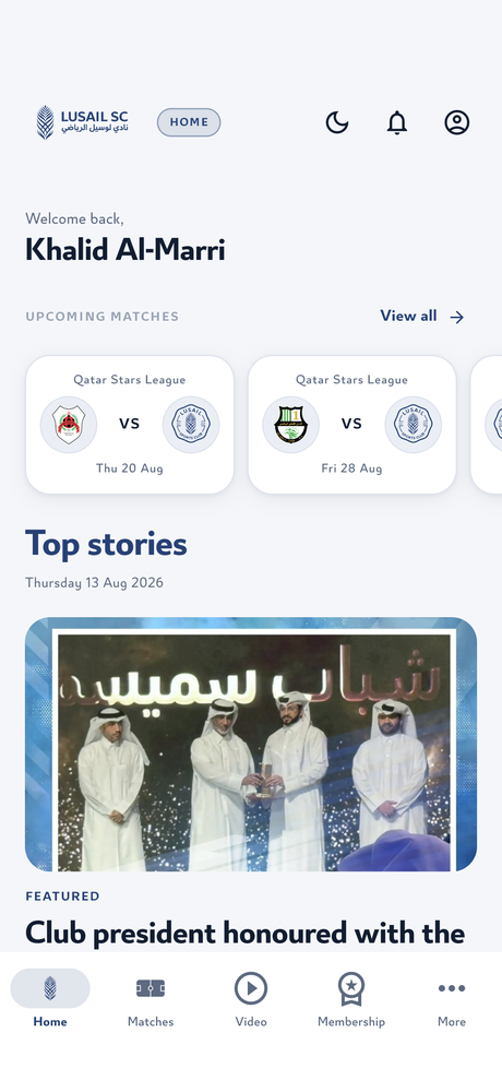 The app's home screen, showing club news and the next match